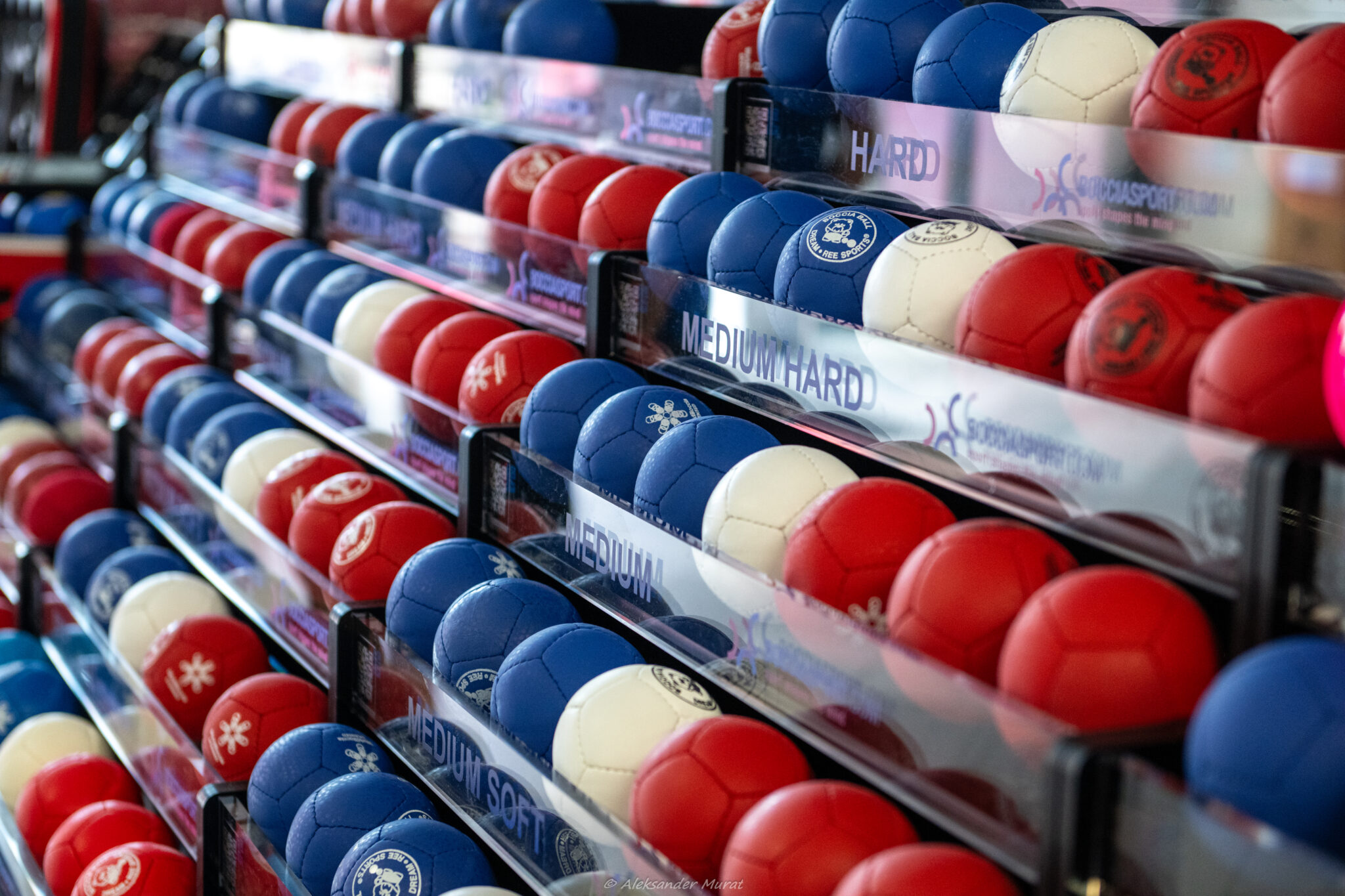 Boccia balls of different hardness on a rack, the kind of data a boccia training app analyses